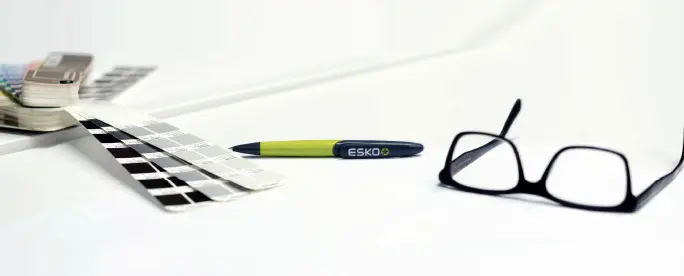 Glasses, pen and stencil on the desk