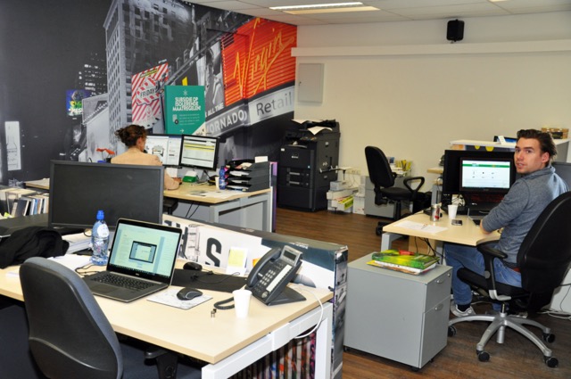 Photo of JMC Signmakers workers processing orders in office