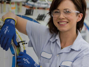 a woman working with protective goggles