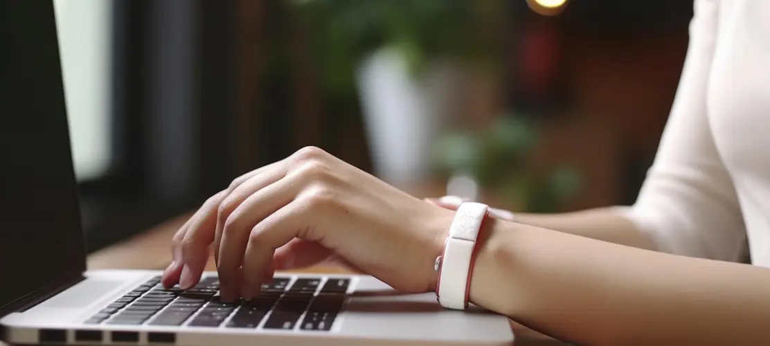 Women's hands writing on the laptop