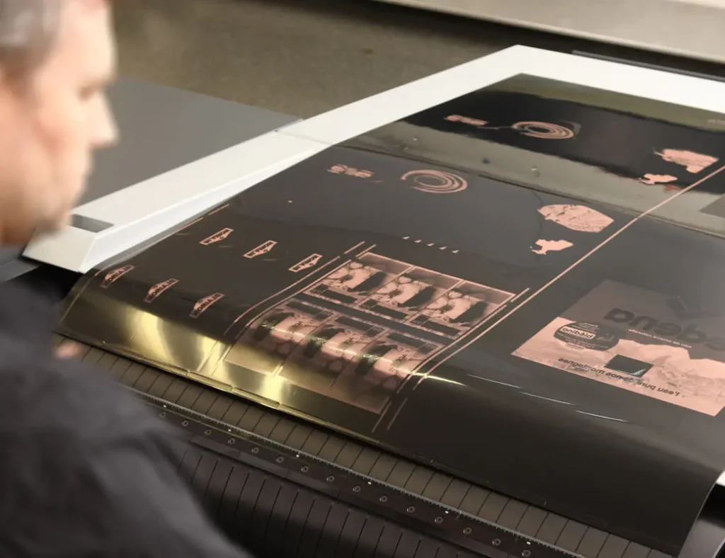 A man looking at a flexo plate