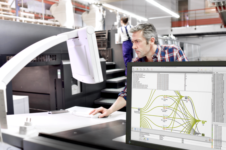 Man working on front of monitor displaying Automation Engine