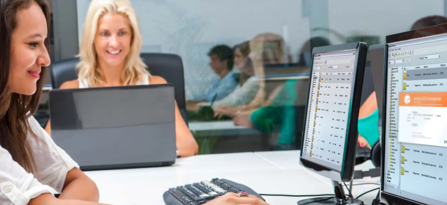 Two women at the desk