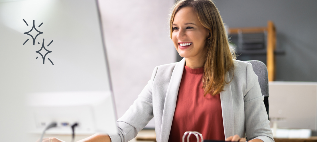 Photo of a woman sitting at a computer