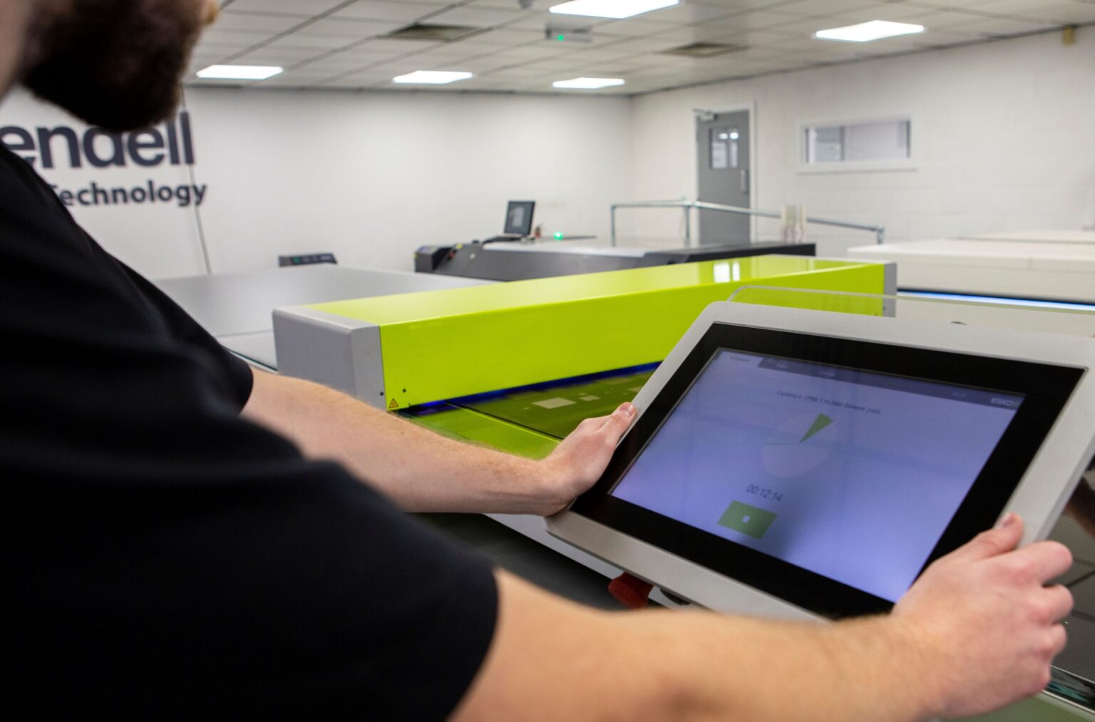 Photo of Rivendell employee running a crystal screening on the machine.